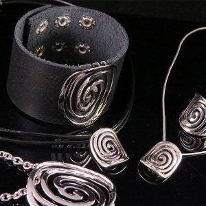 Black leather jewelry with silver detail in powerful design - 